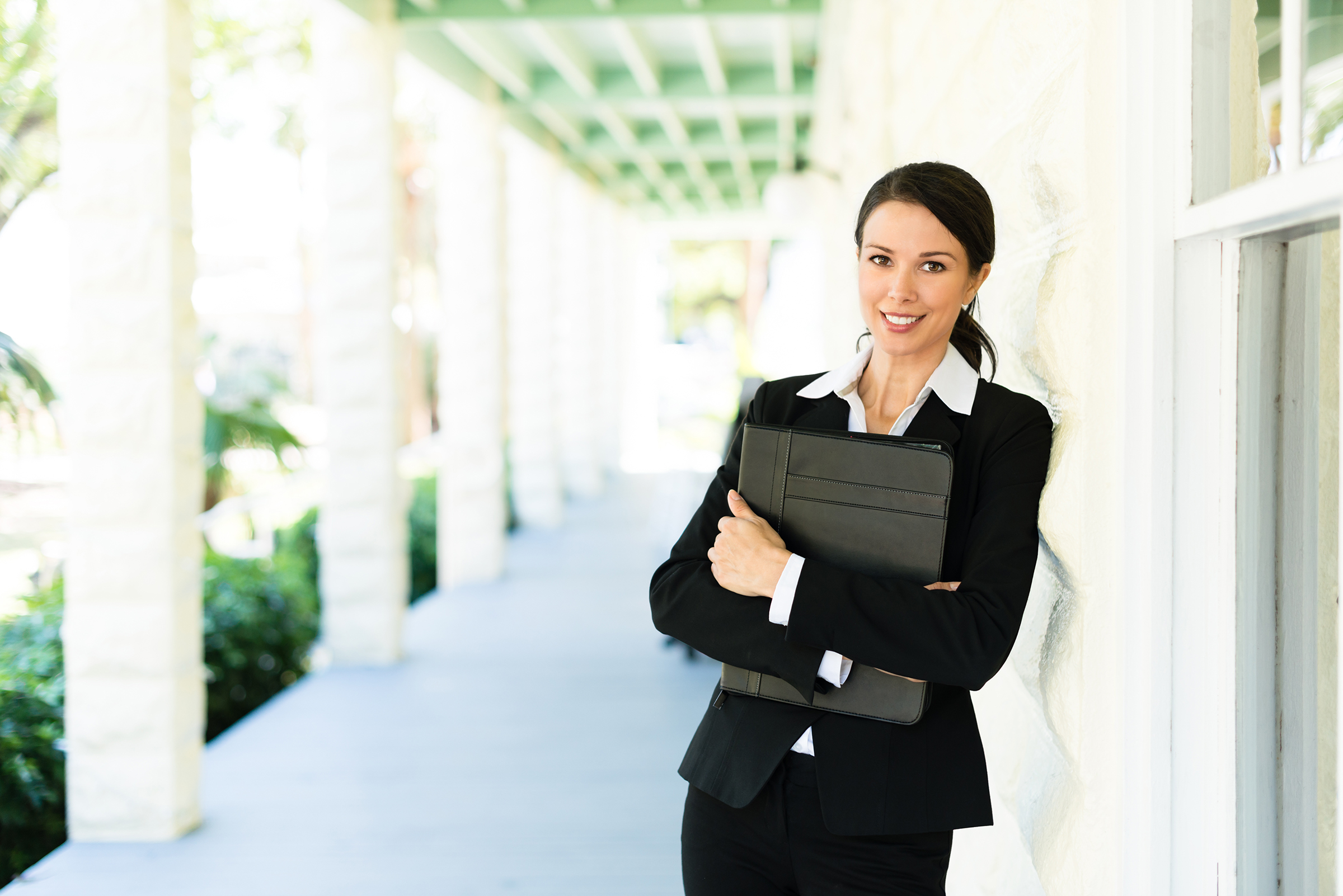 Real Estate Agent on House Veranda